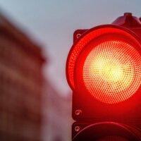 A city crossing with a semaphore. Red light in semaphore A city crossing with a semaphore. Red light in semaphore